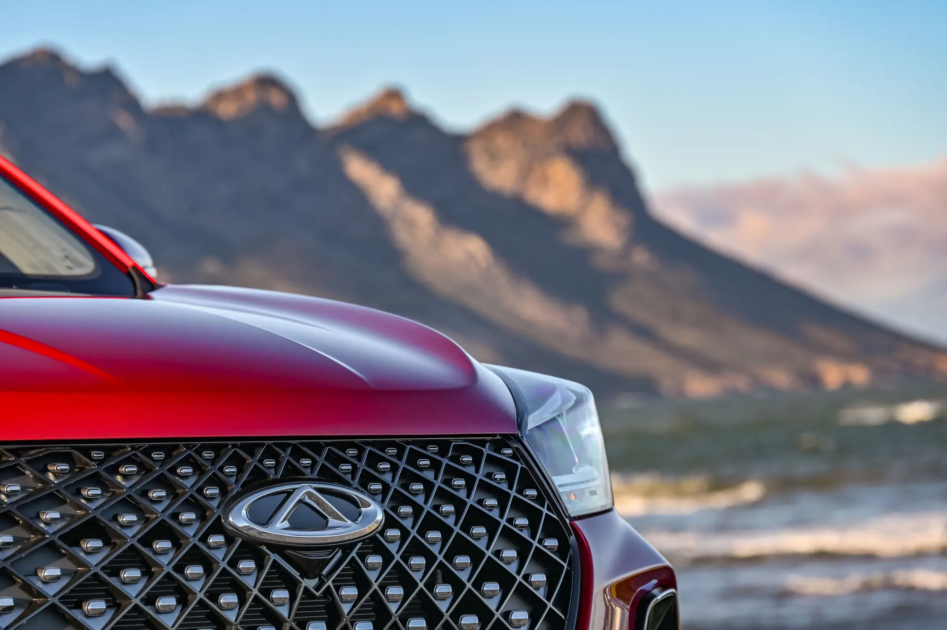 Bonnet and Grille Close up of Red Chery Tiggo 4 Pro. Available at Thorp Chery